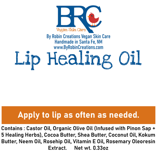By Robin Creations lip healing oil, a nourishing lip balm with a sleek tube and clear branding, designed to repair and hydrate lips.