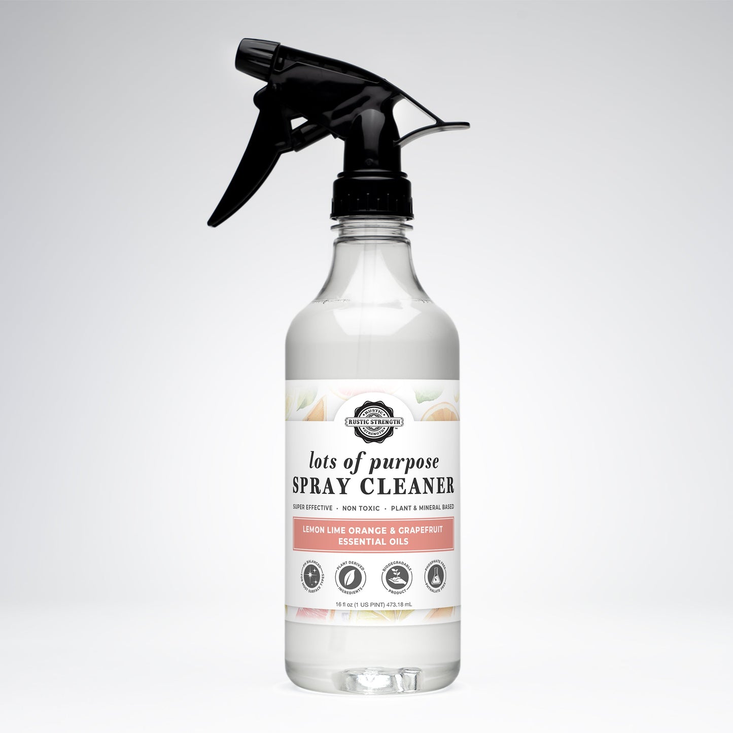 A clear Rustic Strength Lots of Purpose Spray Cleaner with lemon, lime, orange, and grapefruit oils is shown with a black spray nozzle against a white background.