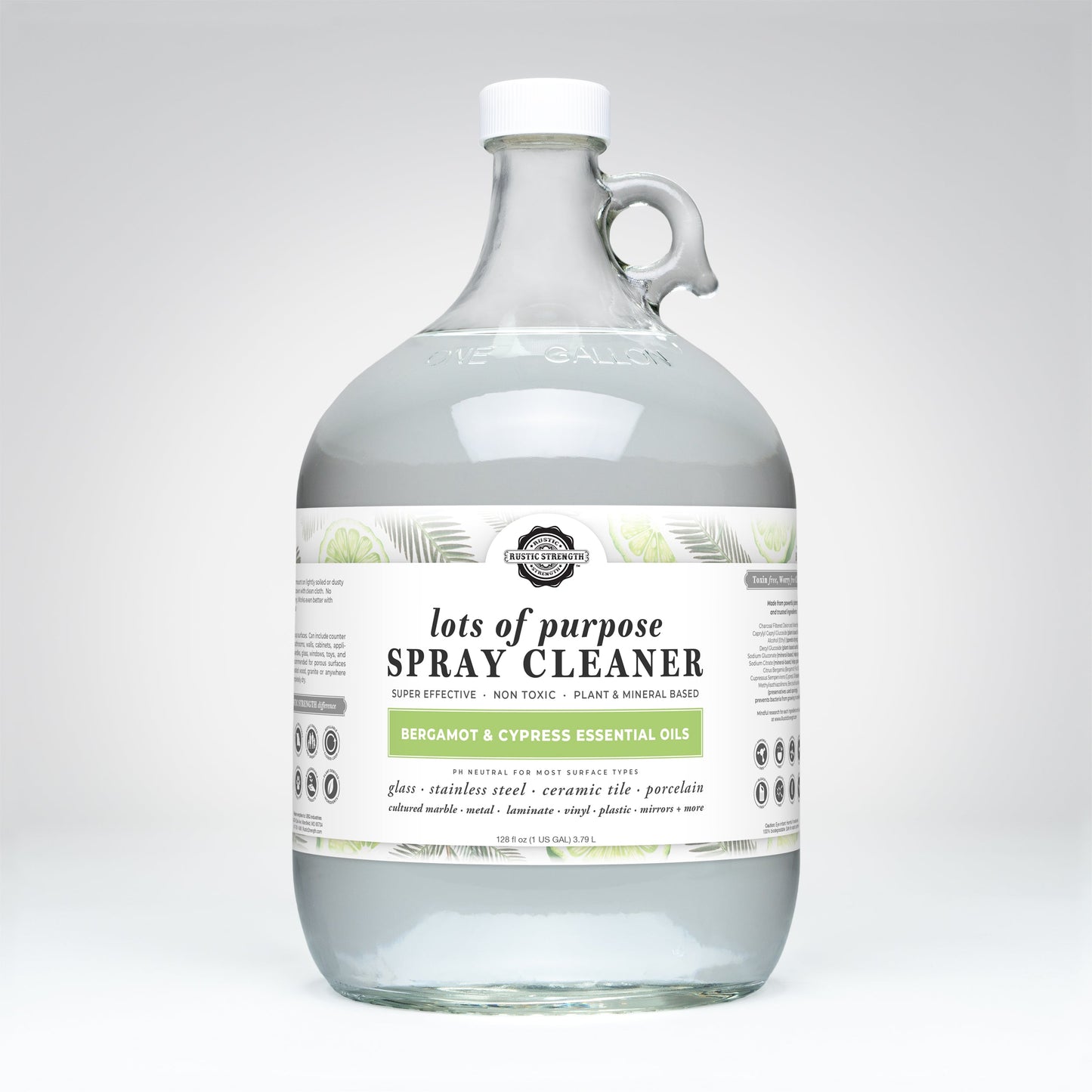 A clear glass gallon jug of Rustic Strengths Lots of Purpose Spray Cleaner | Bergamot & Cypress, a non-toxic, plant and mineral-based multi-surface cleaner safe for glass, tile, and porcelain.