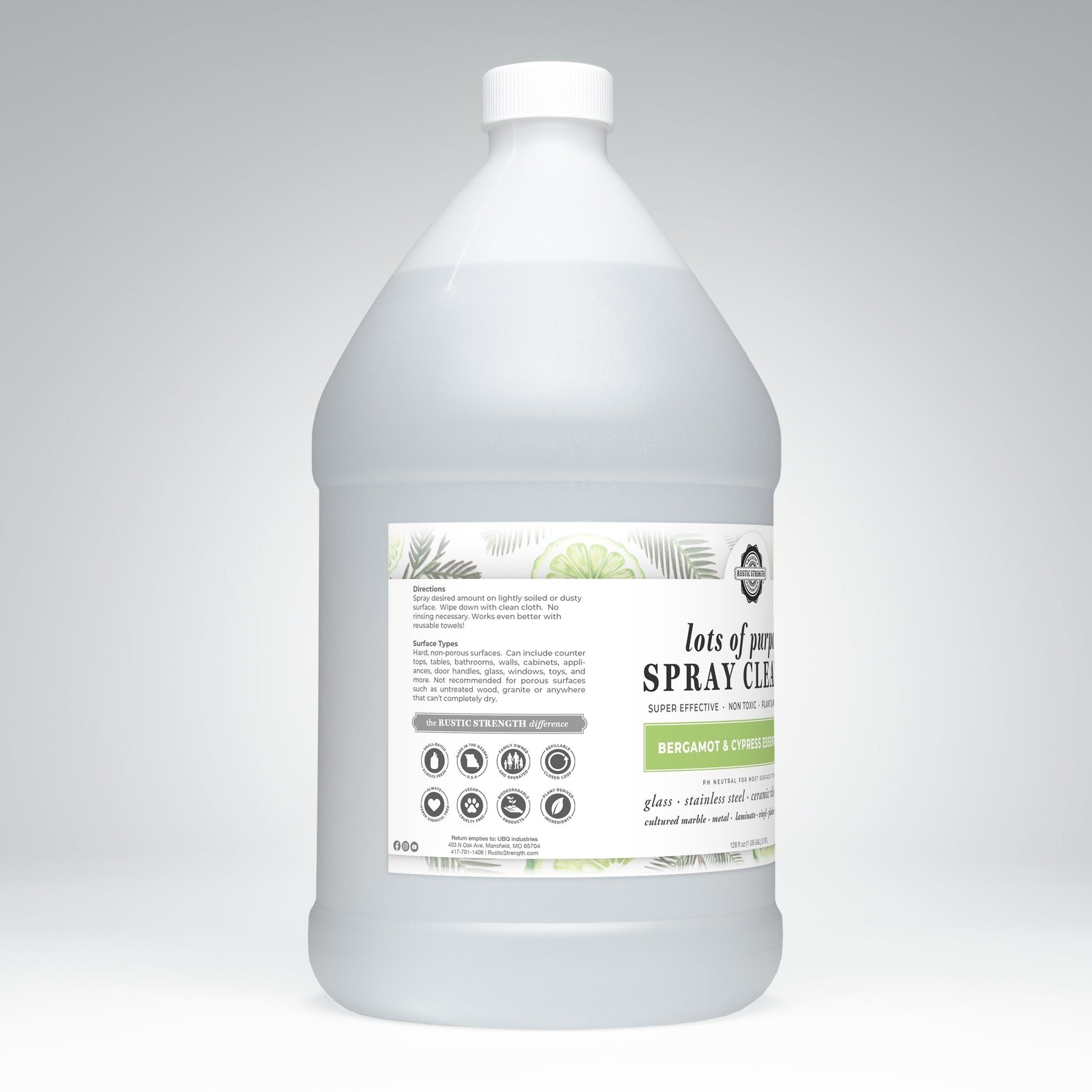A large, clear plastic gallon bottle of Rustic Strength Lots of Purpose Spray Cleaner | Bergamot & Cypress, featuring instructions and icons on the front, is shown against a light gray background.