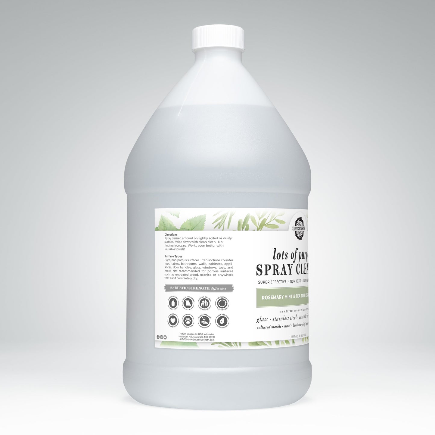 A large clear plastic gallon bottle with a white cap, labeled Rustic Strength Lots of Purpose Spray Cleaner | Rosemary, Mint & Tea Tree; the label features usage directions, warnings, and decorative green leaf illustrations.