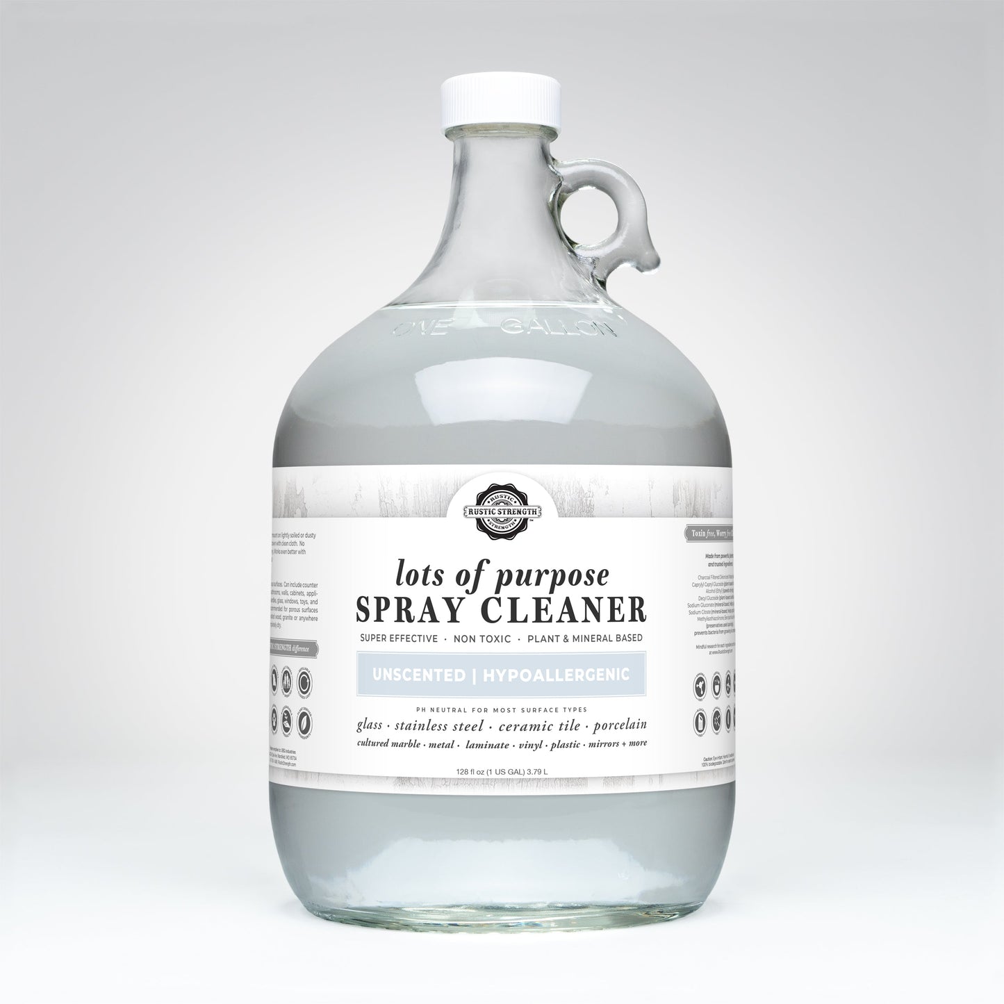 A clear one-gallon jug with a handle, filled with Rustic Strength’s Lots of Purpose Spray Cleaner | Unscented. The white label highlights this plant and mineral-based, hypoallergenic, toxin-free multi-surface cleaner.