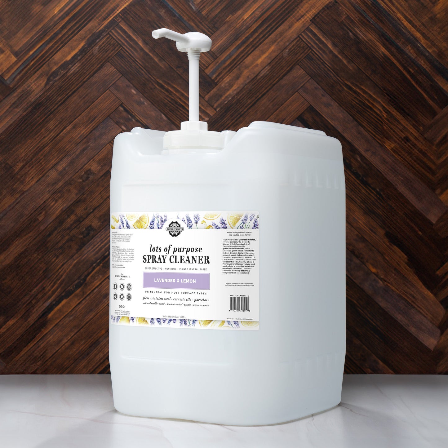 Rustic Strength lavender and lemon multi-purpose spray cleaner in a 5-gallon jug with pump for versatile cleaning.