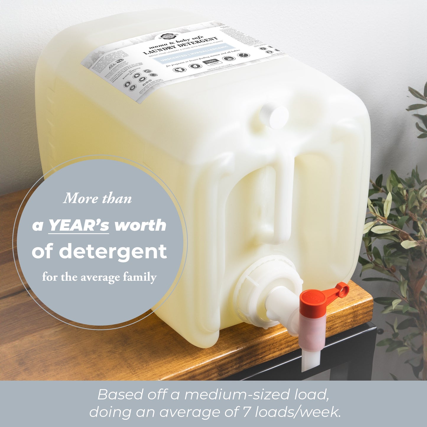 A large white plastic container with a spout sits on a table. Text reads: Over one year of Rustic Strength Mama + Baby Safe hypoallergenic laundry detergent for an average family (7 medium loads/week).