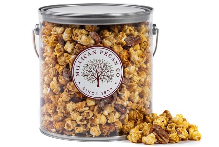 Millican Pecan caramel pecan popcorn in a 1-gallon pail, featuring golden caramel coating and crunchy pecan pieces.