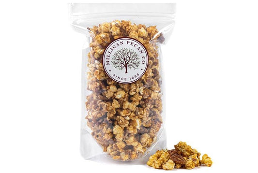 Millican Pecan caramel pecan popcorn bag, 12oz, featuring crunchy pecans and rich caramel coating in a snack bag.