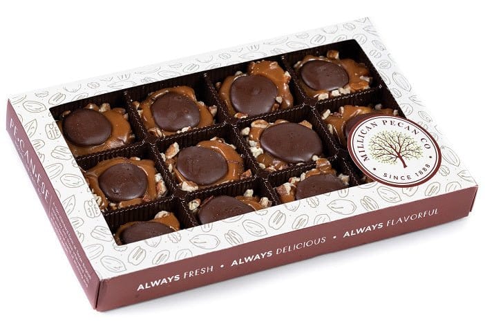 Dark chocolate Caramillicans pecan treats in an 8oz gift box by Millican Pecan, featuring glossy chocolate coating and crunchy pecans.