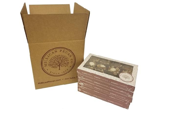Millican Pecan gift box with three chocolate Caramillicans pecan treats arranged in a case of five.