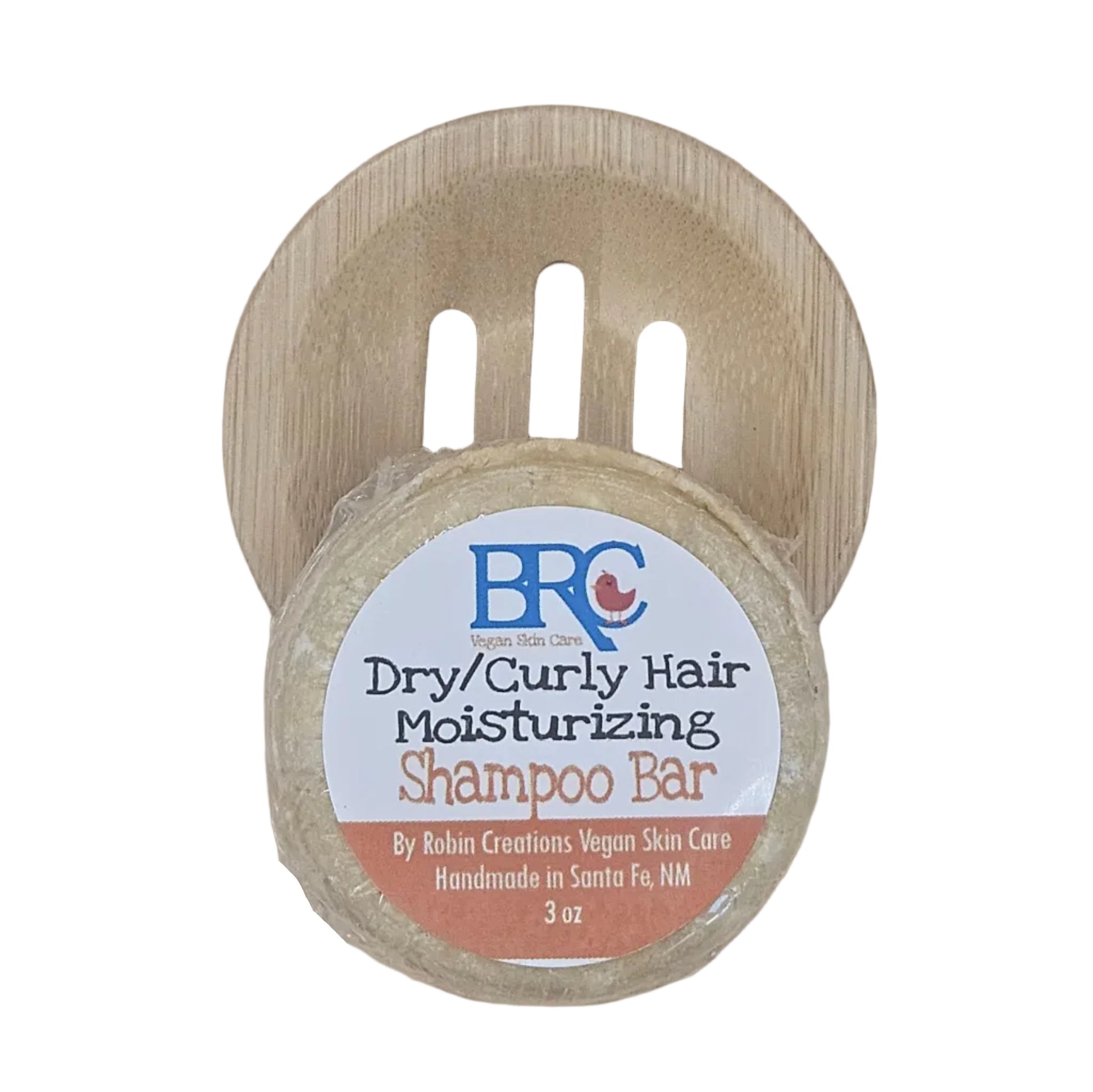 By Robin Creations moisturizing shampoo bar for dry and curly hair placed on a tray, showcasing its natural, nourishing formula.
