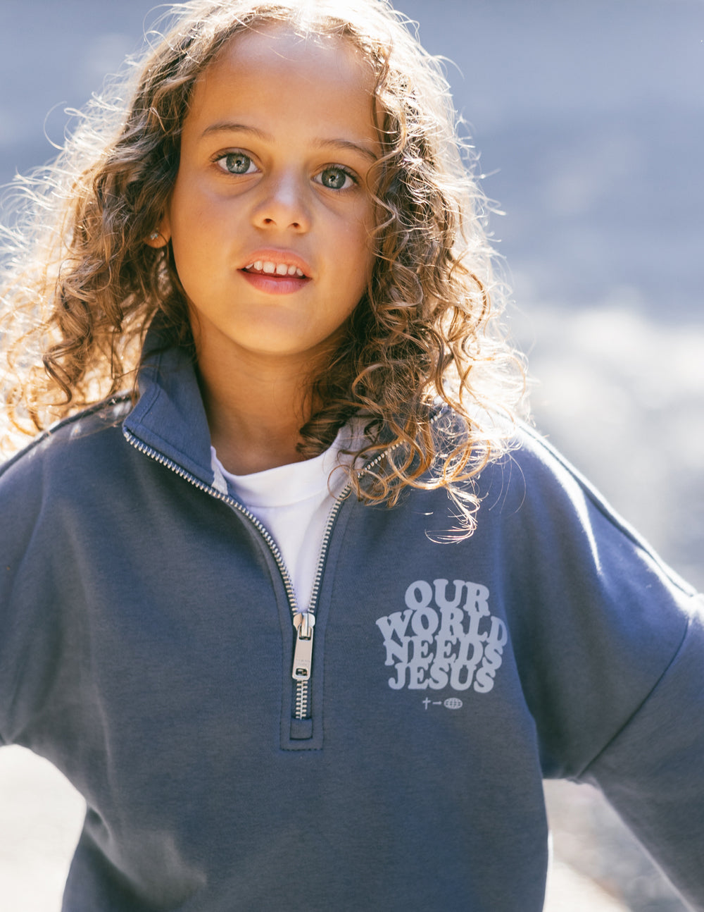 Our World Needs Jesus Kids Half-Zip - Blessings Grow Meadows