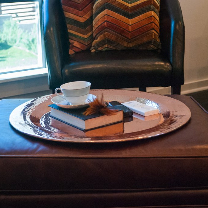 Copper Thessaly round platter from Sertodo, showcasing a polished, round plate with a smooth finish and warm copper tone.