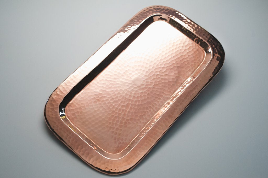 Copper Charolita tray by Sertodo, a round platter with a polished copper finish, ideal for serving appetizers or display.