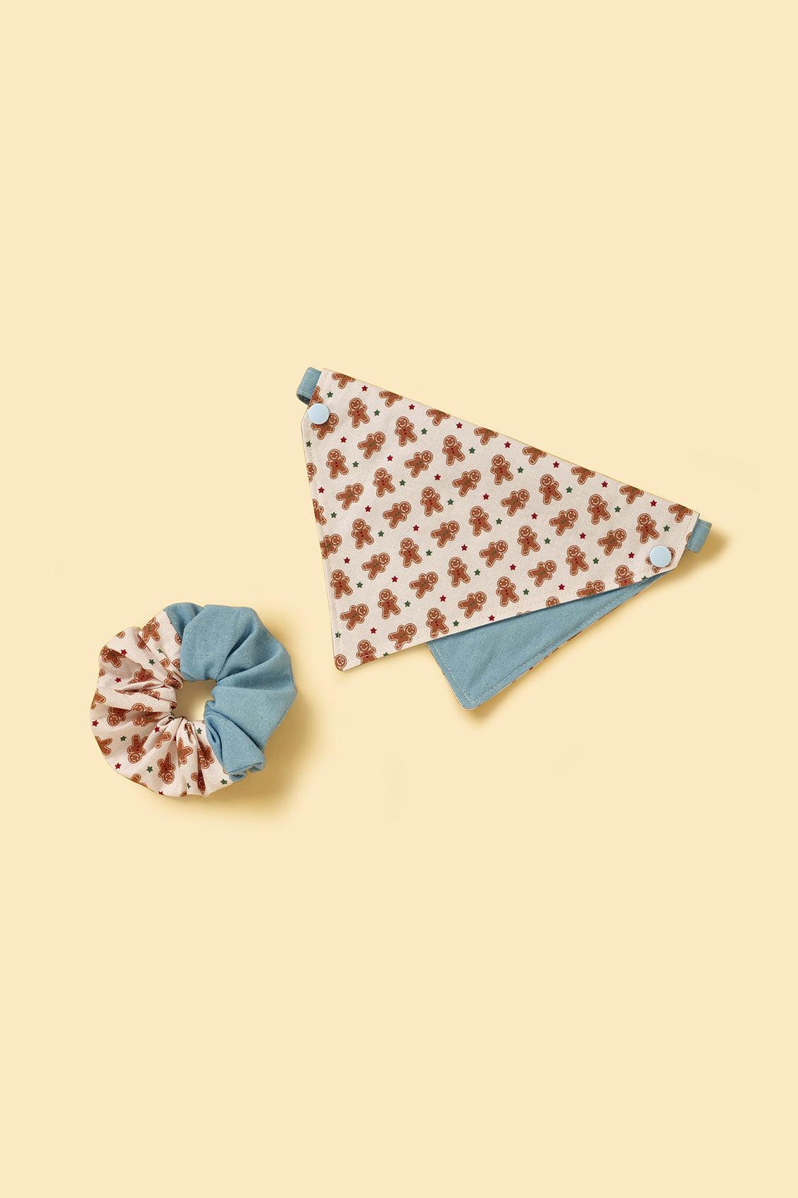Joy handmade gingerbread man scrunchie by BarkBarkBaby featuring a festive gingerbread man design on soft fabric.