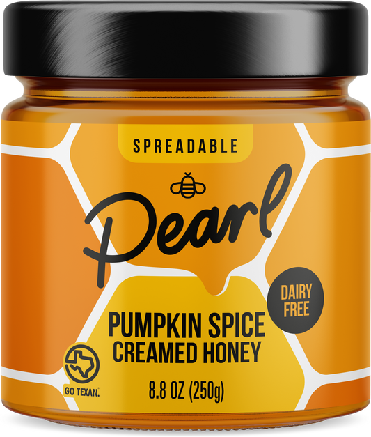 Creamed honey with pumpkin spice flavor from Pearl Honey Spreads, featuring a jar of rich, spiced honey with pumpkin aroma.
