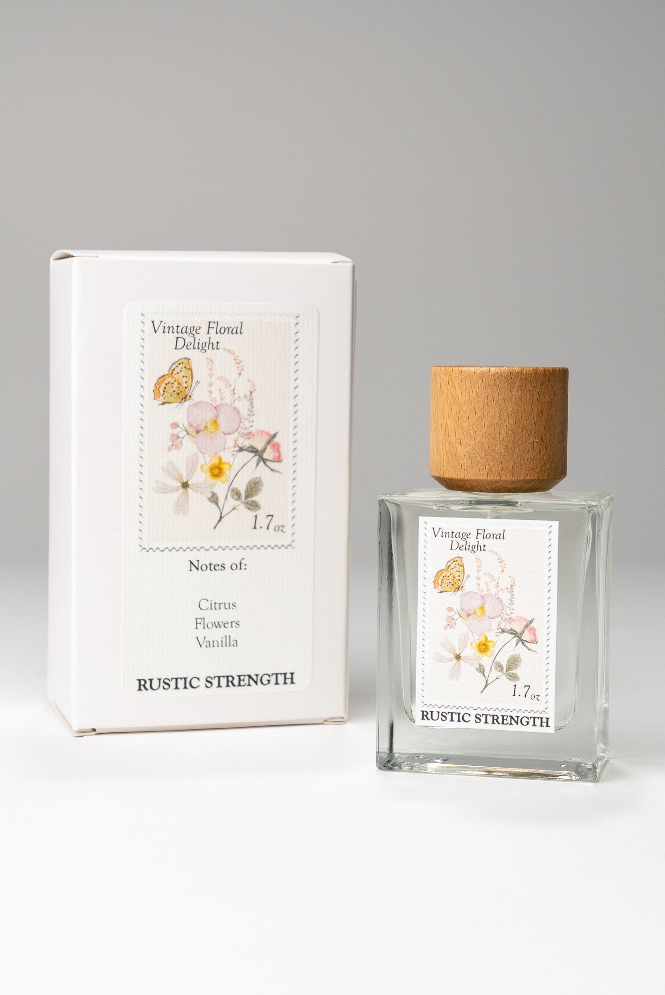 Rustic Strength Vintage Floral Delight perfume bottle, 1.7oz, with a vintage floral design and elegant glass container.