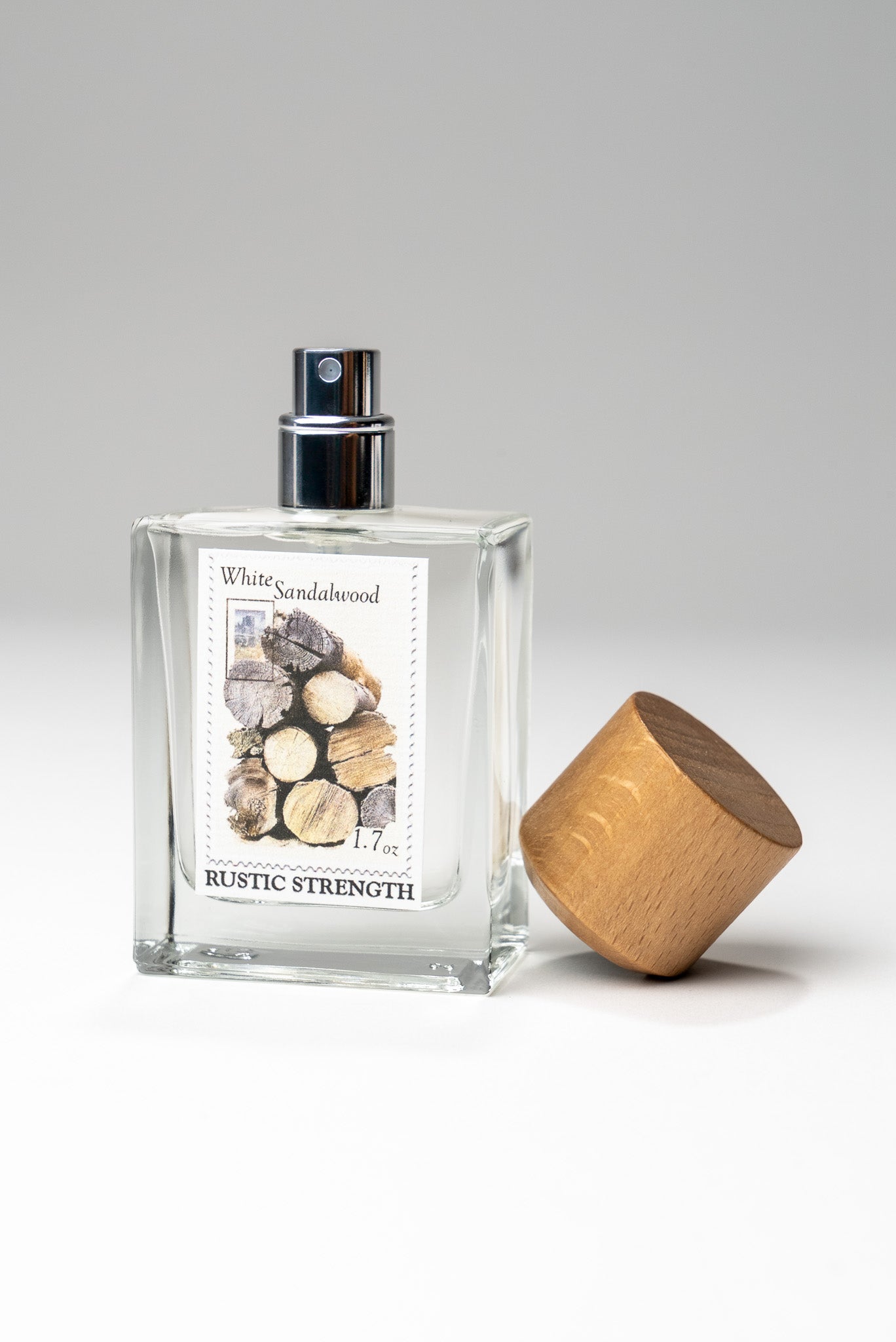 Rustic Strength white sandalwood perfume in a 1.7oz bottle, featuring a woody, aromatic scent with elegant packaging.