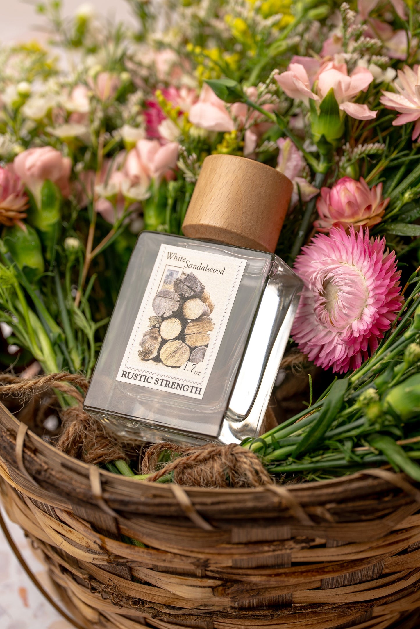 Rustic Strength White Sandalwood perfume bottle, 1.7oz, with elegant packaging and clear fragrance details on the label.