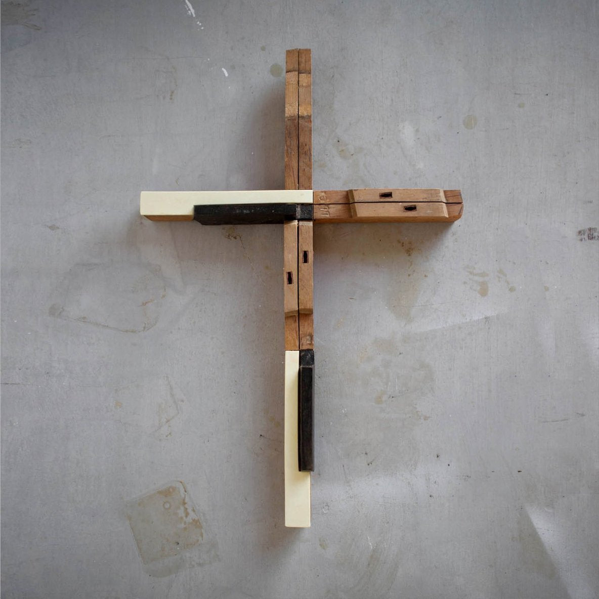 Wooden piano key cross by Dennehey Design Co. featuring a detailed cross with piano key motifs, crafted from natural wood.