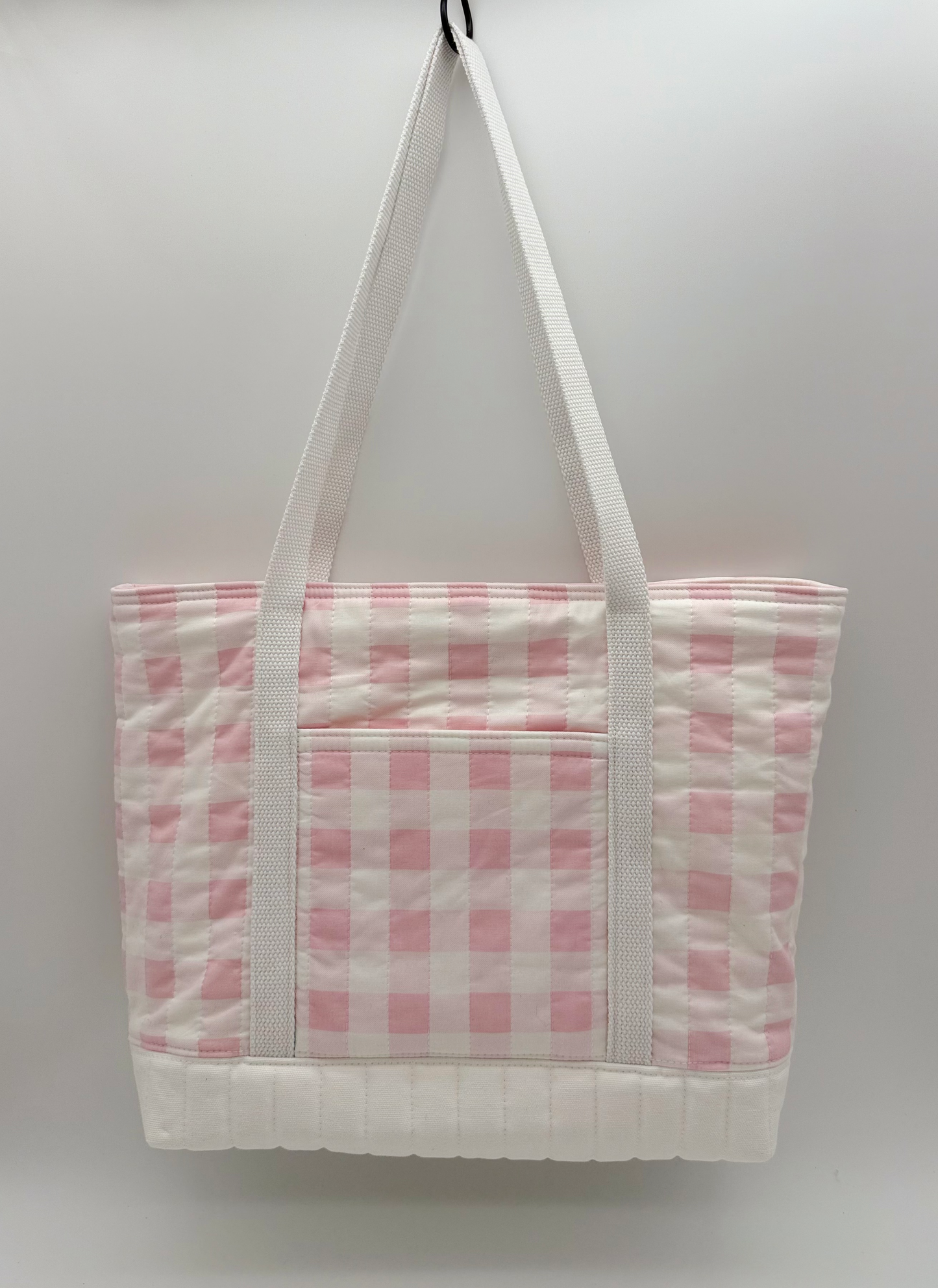 Back view of a pink gingham quilted canvas tote bag with snap closure by C2 Creations LLC.
