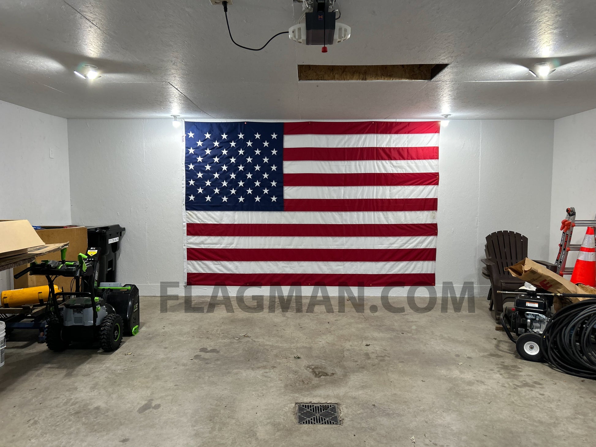 WallSafe™ polyester American flag with reinforced edge grommets, wall-mounted, made in USA, features vibrant stars and stripes.