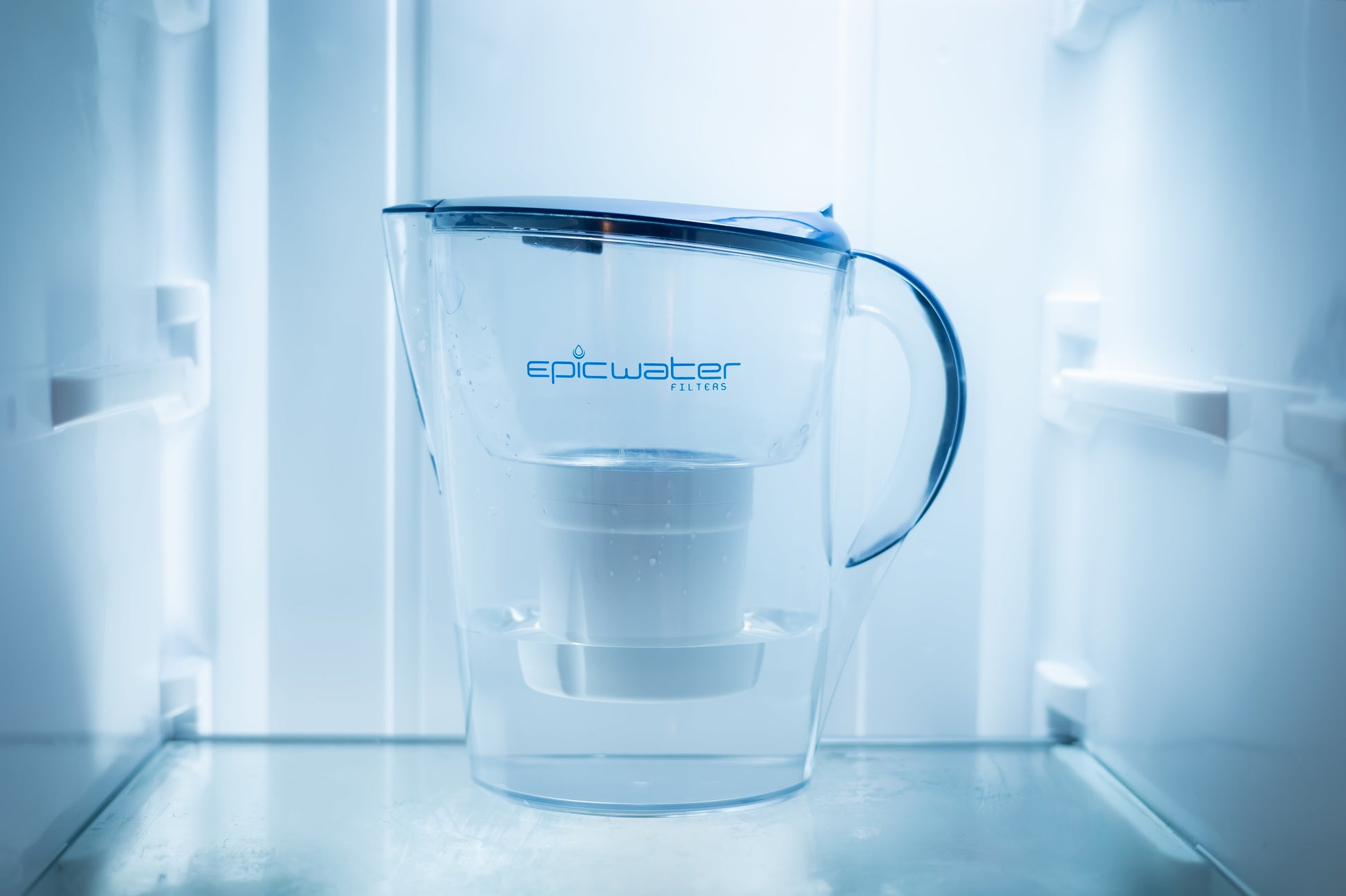 Blue-lid Pure XP water pitcher by Epic Water Filters USA, designed to reduce fluoride, PFAS, and parasites.