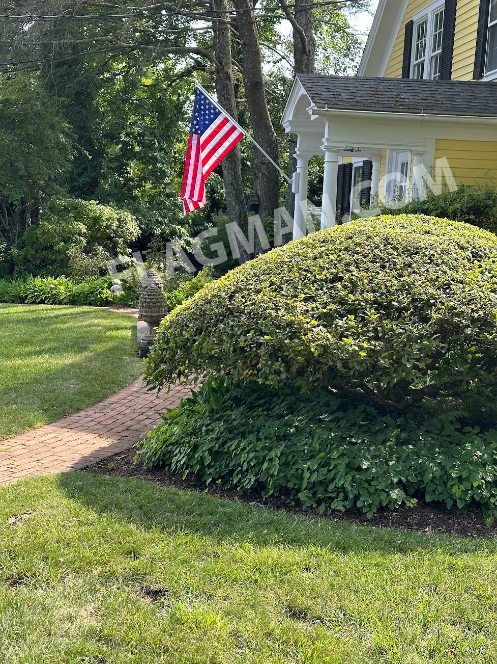 Liberty™ Nylon American flag by Flagman of America, featuring vibrant red, white, and blue colors, displayed outdoors.