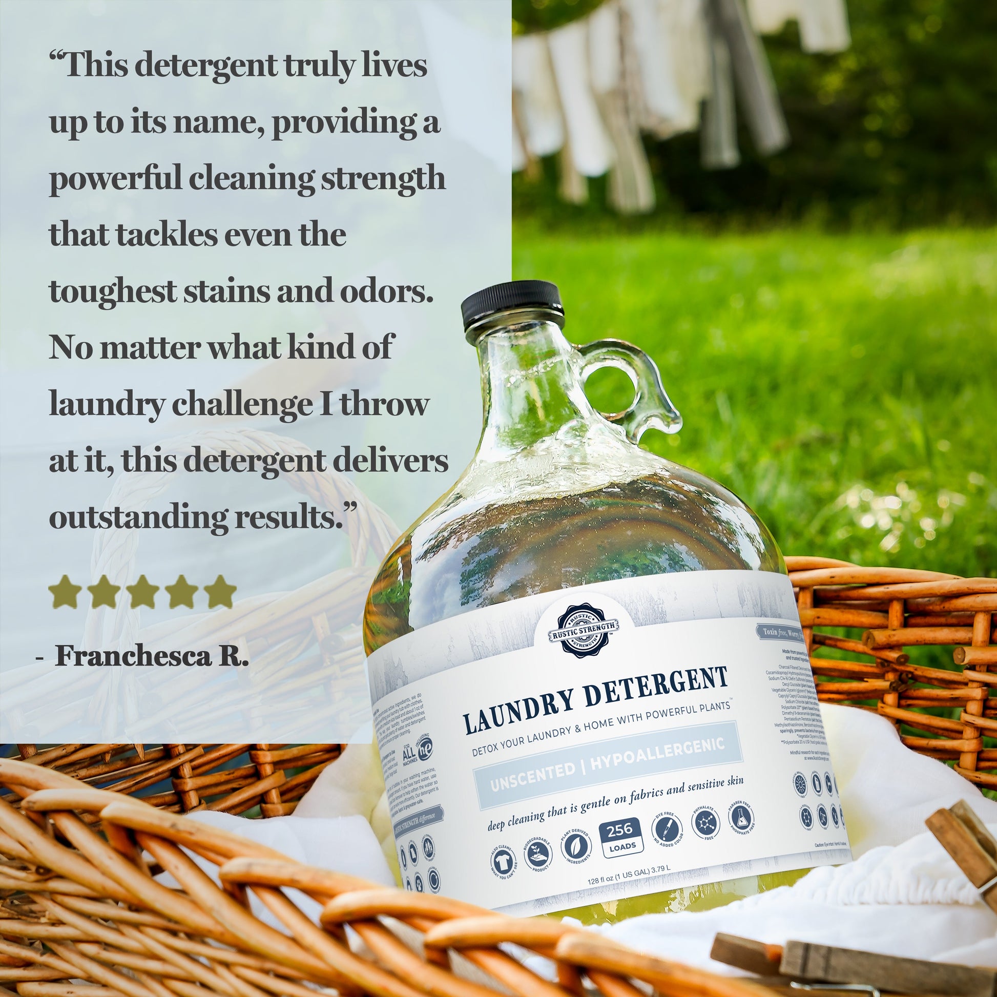 A large clear jug of Rustic Strength Laundry Detergent | Unscented sits in a wicker basket on grass. A customer review and five stars praise its hypoallergenic, biodegradable formula for effectively removing stains and odors.