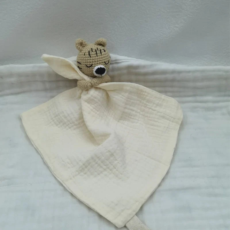 Baby bib with sleeping animals and rattle from Petite Pioneers, featuring soft fabric and adorable animal designs for infants.