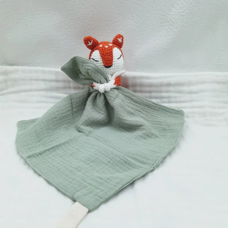Baby bib with sleeping animals and rattle from Petite Pioneers, featuring soft fabric and cute animal designs.