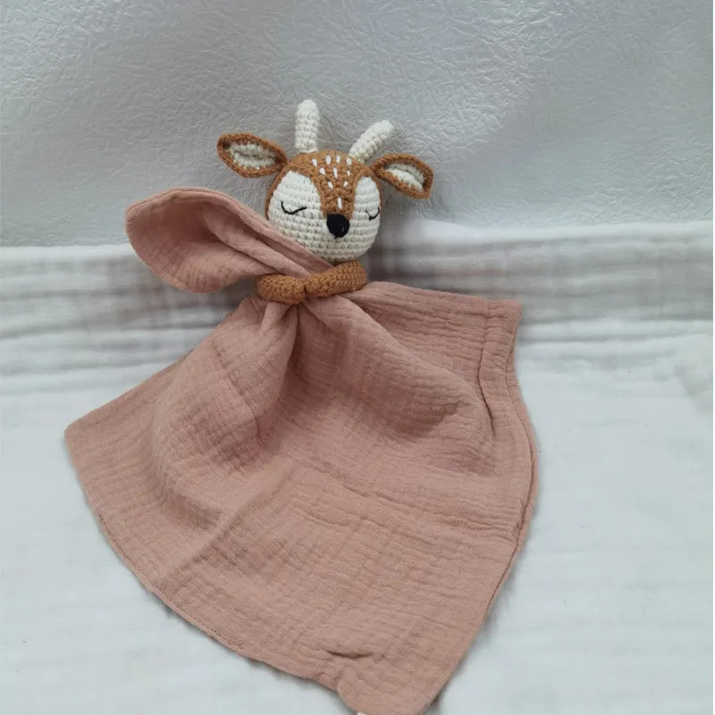 Baby bib with sleeping animals and rattle by Petite Pioneers, featuring soft fabric and colorful animal designs for infants.