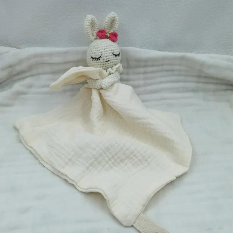 Baby bib with sleeping animals and rattles, featuring soft fabric and colorful design from Petite Pioneers.