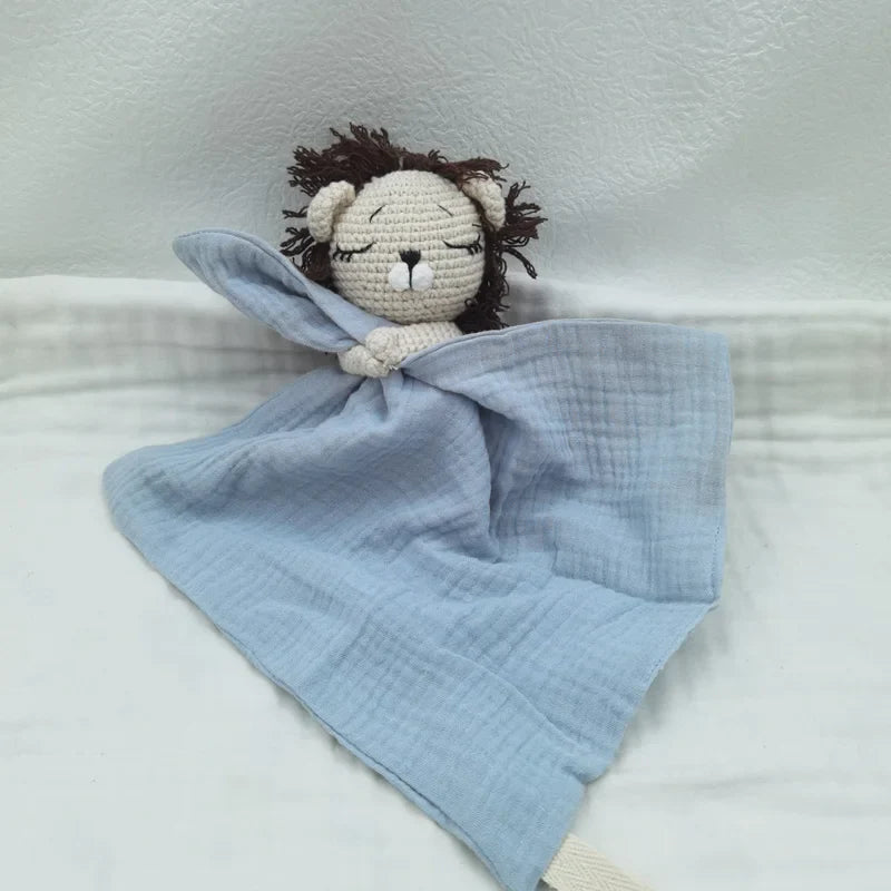 Baby bib with sleeping animals rattle from Petite Pioneers, featuring soft fabric and adorable animal designs for infants.
