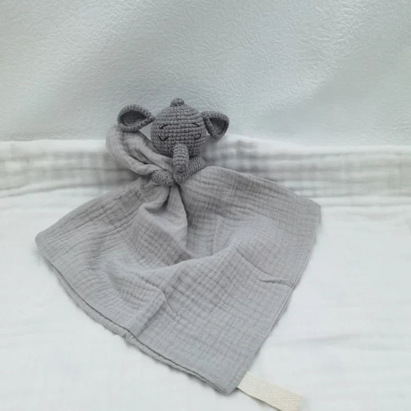 Baby bib with sleeping animals and rattle by Petite Pioneers, featuring soft fabric and playful animal designs for infants.