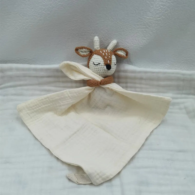 Baby bib with sleeping animal design and attached rattle by Petite Pioneers, soft fabric with cute animal prints.