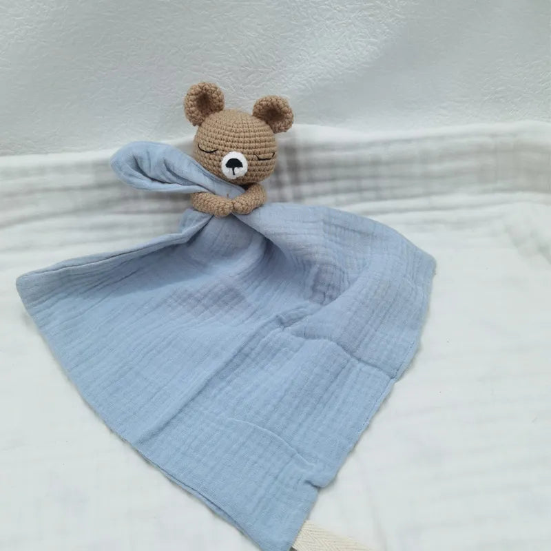 Petite Pioneers baby bib with sleeping animals and rattle, soft fabric, and adorable animal designs for infants.