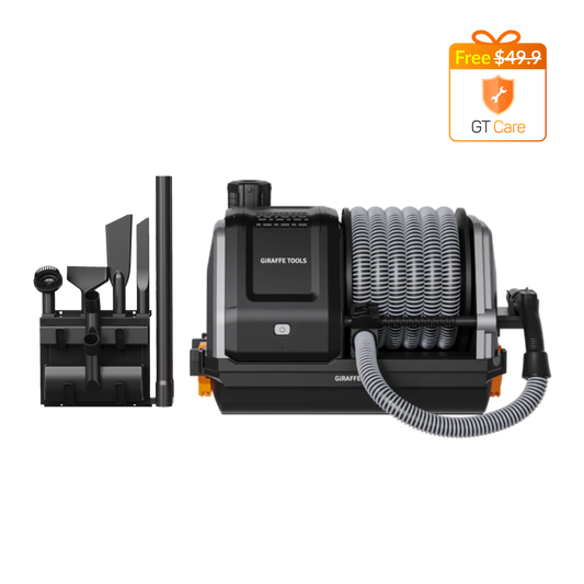 Giraffe Tools US Grandstorm retractable garage vacuum cleaner with hose and attachments in a garage setting