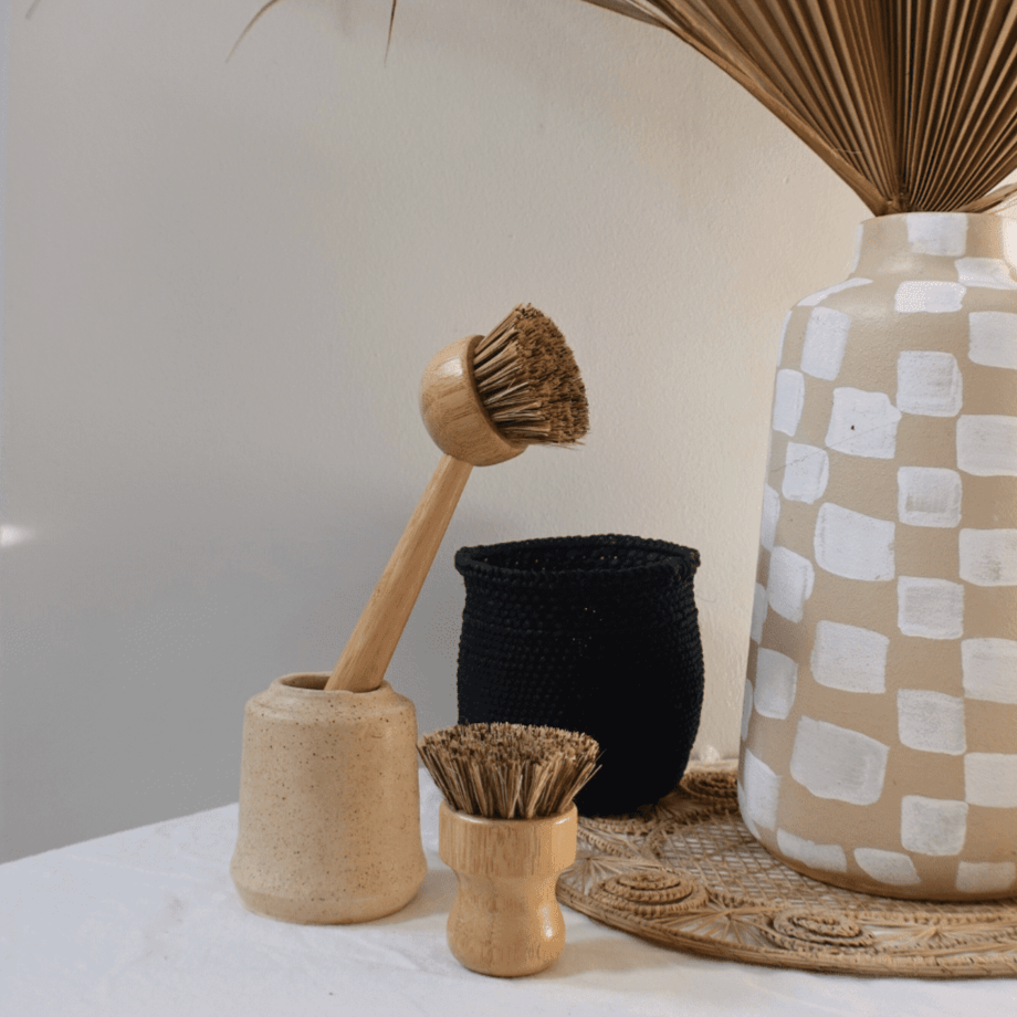 Tilley + Me eco-friendly bamboo dishwashing brush with handle and palm fiber bristles for gentle cleaning.