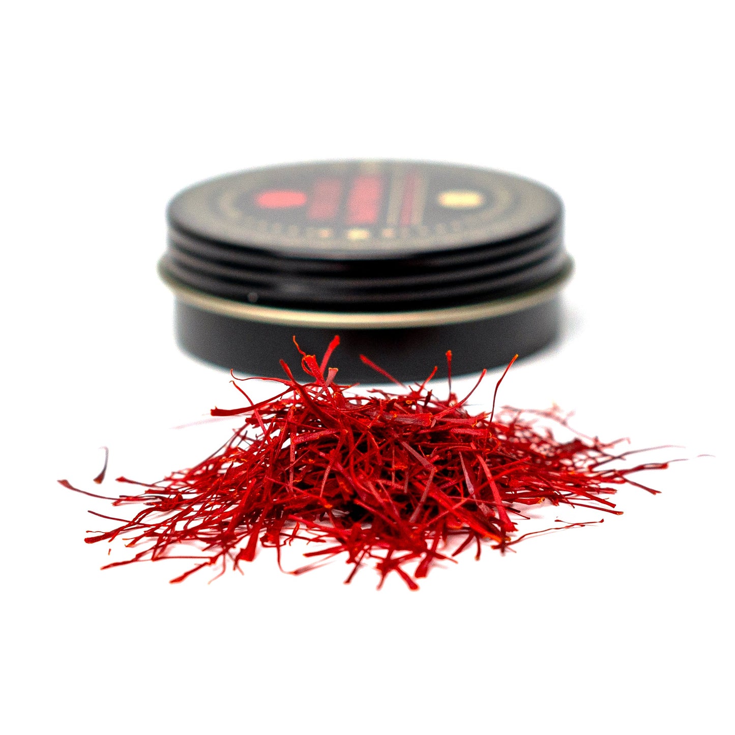 Premium Super Negin saffron threads from Vanilla Bean Kings, showcasing vibrant red-orange threads on a white background.
