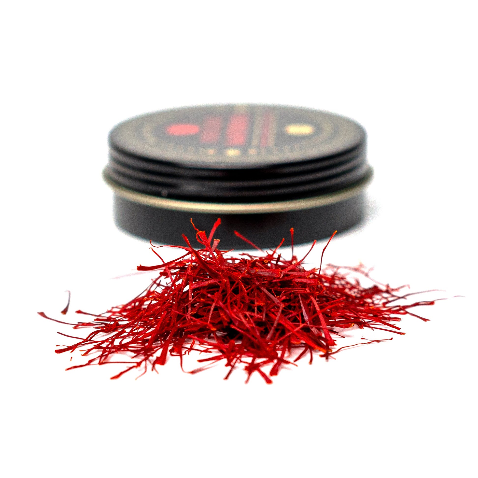 Premium Super Negin saffron threads from Vanilla Bean Kings, showcasing vibrant red-orange threads on a white background.