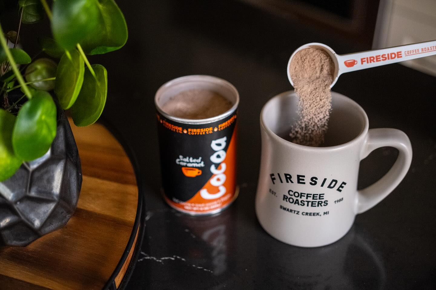 Cup of salted caramel cocoa from Fireside Coffee Co. featuring a creamy, rich hot chocolate topped with caramel and sea salt.