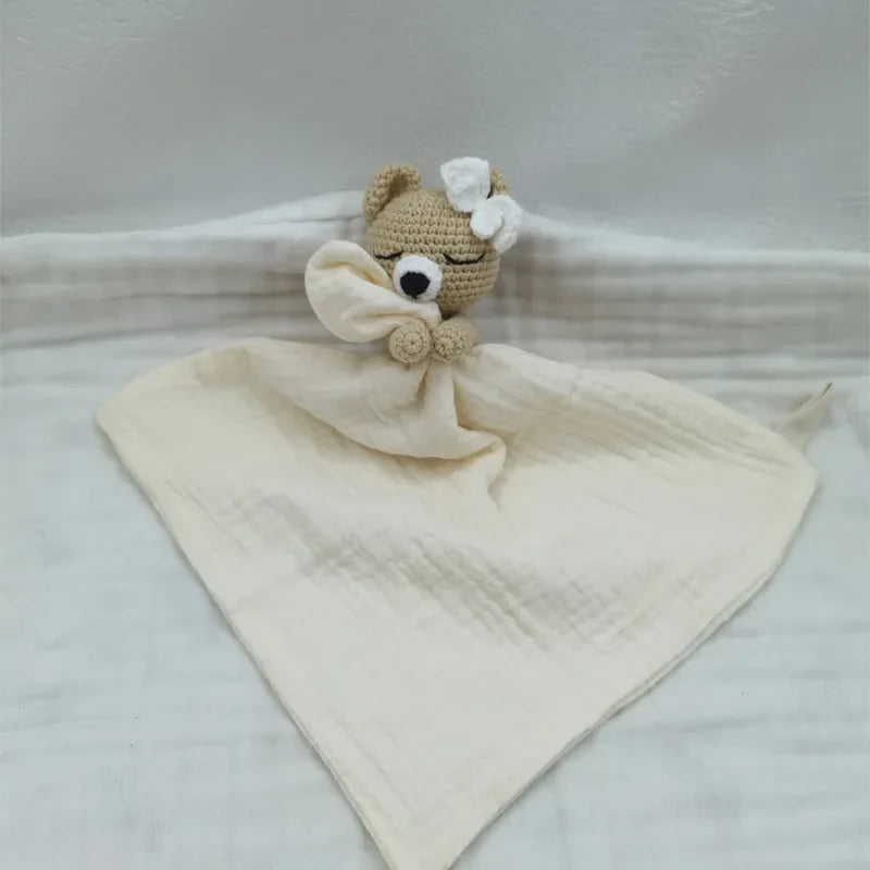 Baby bib with sleeping animals and rattle by Petite Pioneers, featuring soft fabric and colorful animal designs for infants.