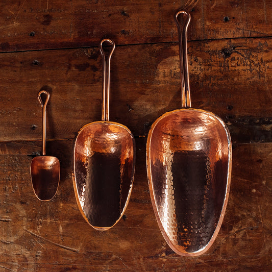 Sertodo copper scoop from barware and bar tools set, with a rounded handle and polished copper finish suitable for bartending.