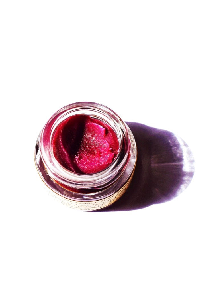 Plant Makeup Hibiscus and Beet Lip Tint tube with swatch showing vibrant pink and red shades on lips and skin.