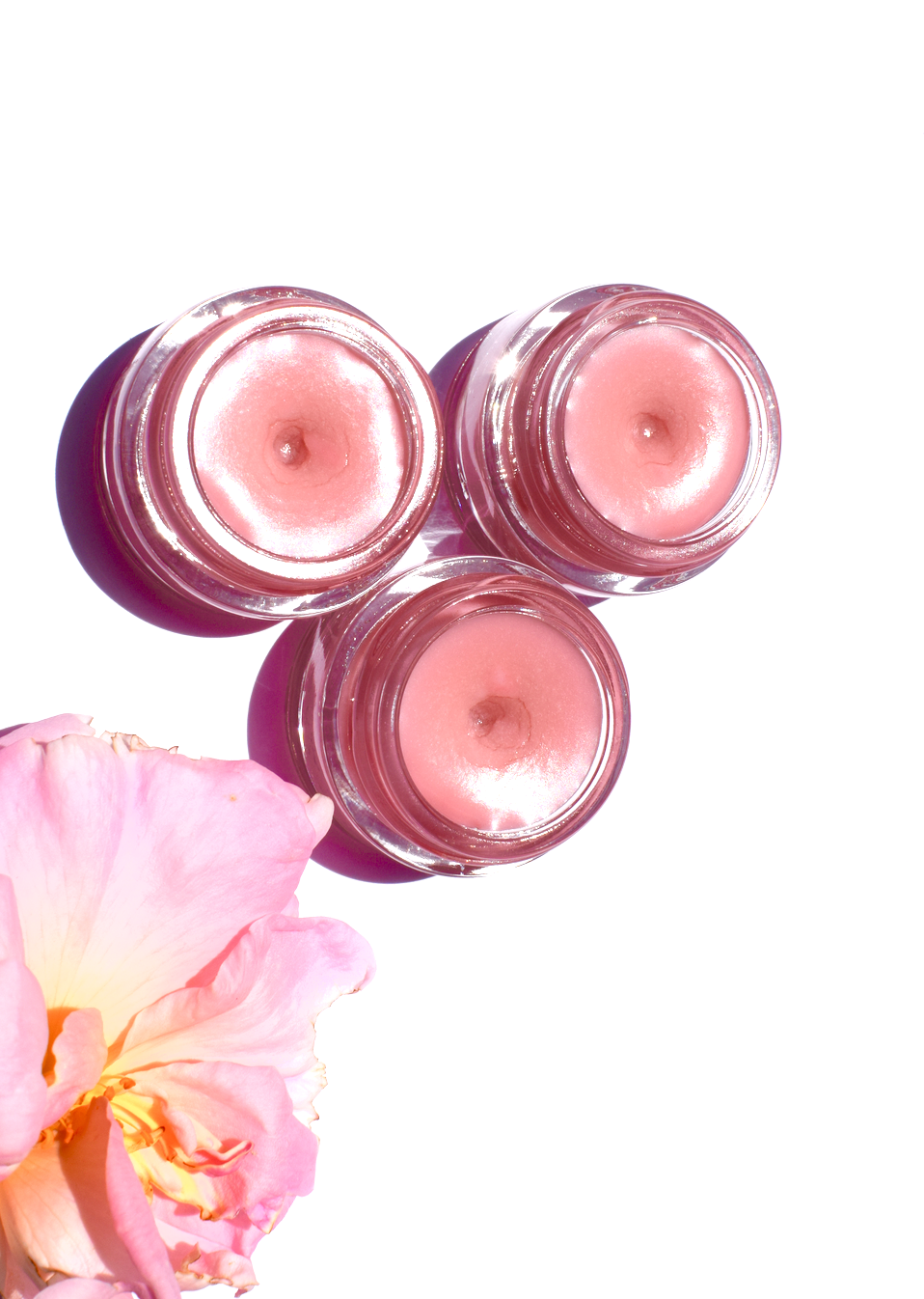 Plant Makeup Strawberry Dreamsicle lip balm scrub in a jar with pink and white swirls, showing the creamy, strawberry-scented formula.