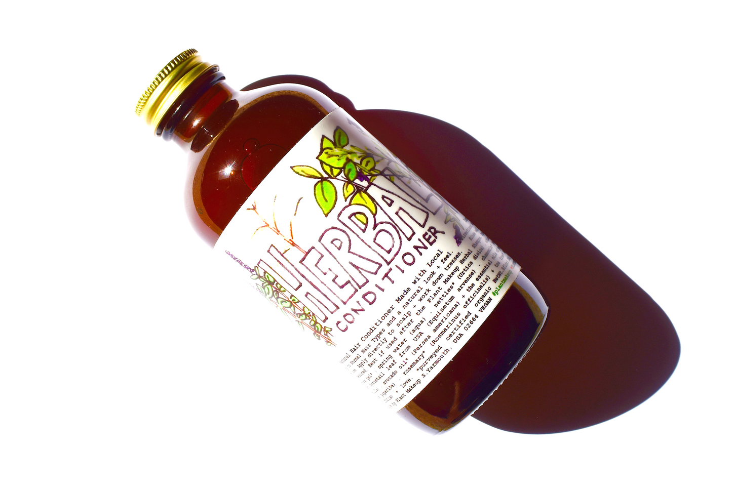 Herbal conditioner from Plant Makeup featuring natural ingredients, in a sleek bottle with a flip-top cap.