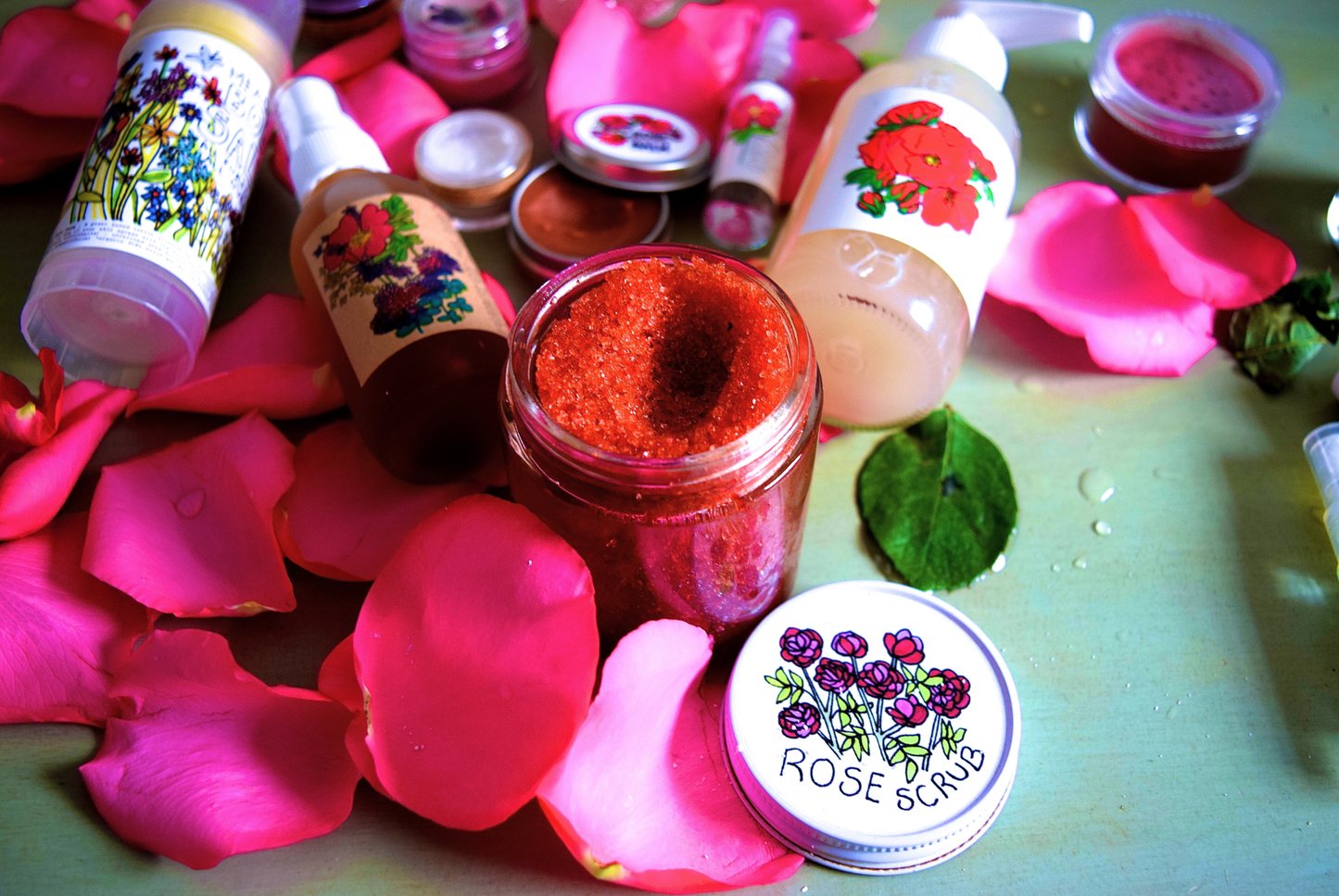 Plant Makeup Beach Rose Scrub jar with label featuring rose imagery and natural ingredients, displayed on a neutral background.