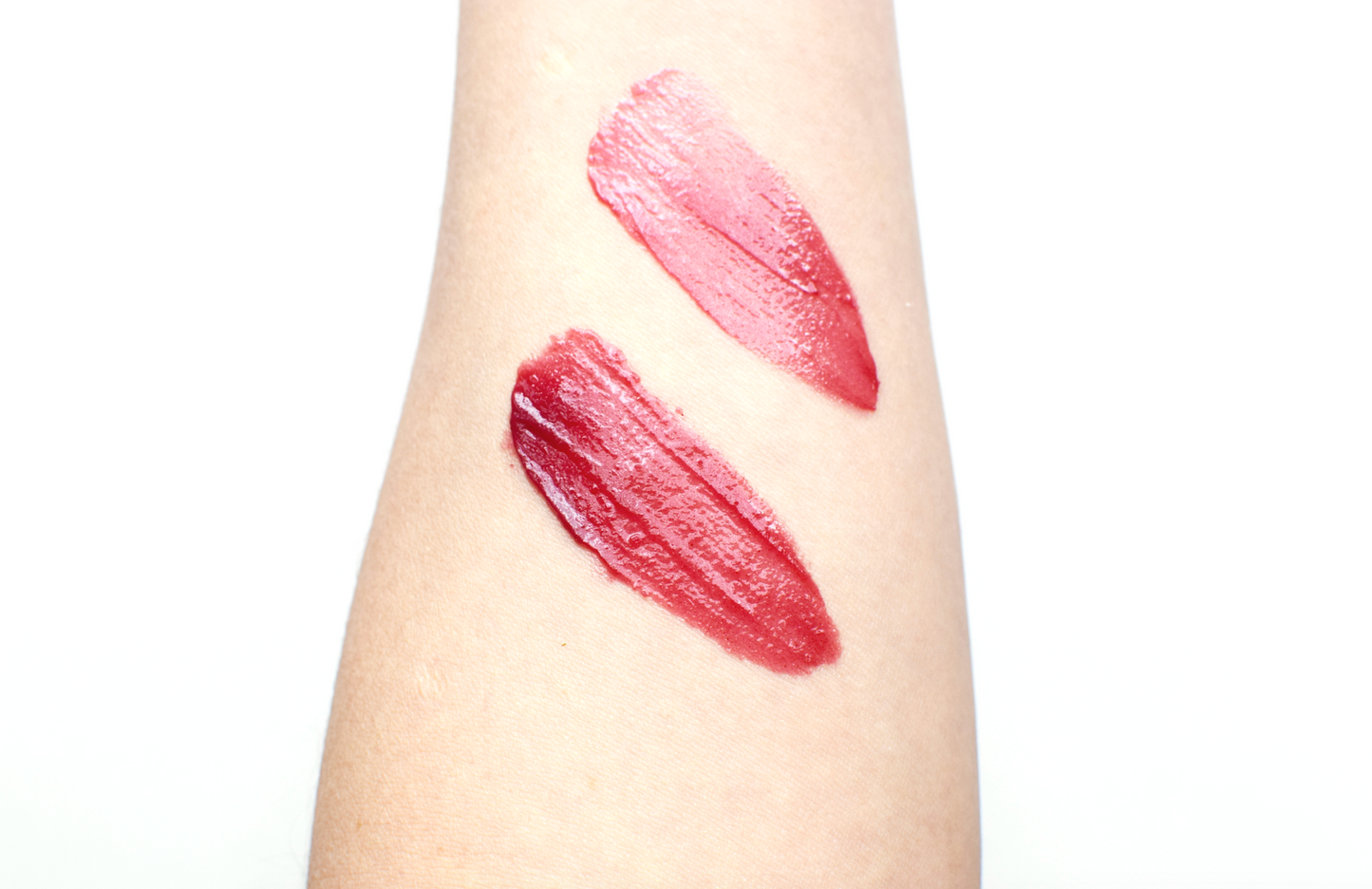 Plant Makeup Hibiscus and Beet Lip Tint in a tube, showcasing vibrant pink and red shades for natural lip color.