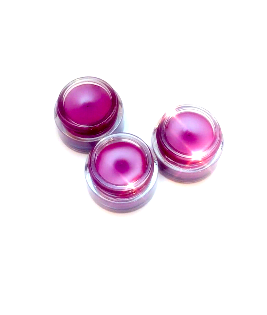 Plant Makeup Dragon Fruit Lip Gloss tube with vibrant pink packaging and glossy finish, showcasing a fruity, colorful lip gloss product.