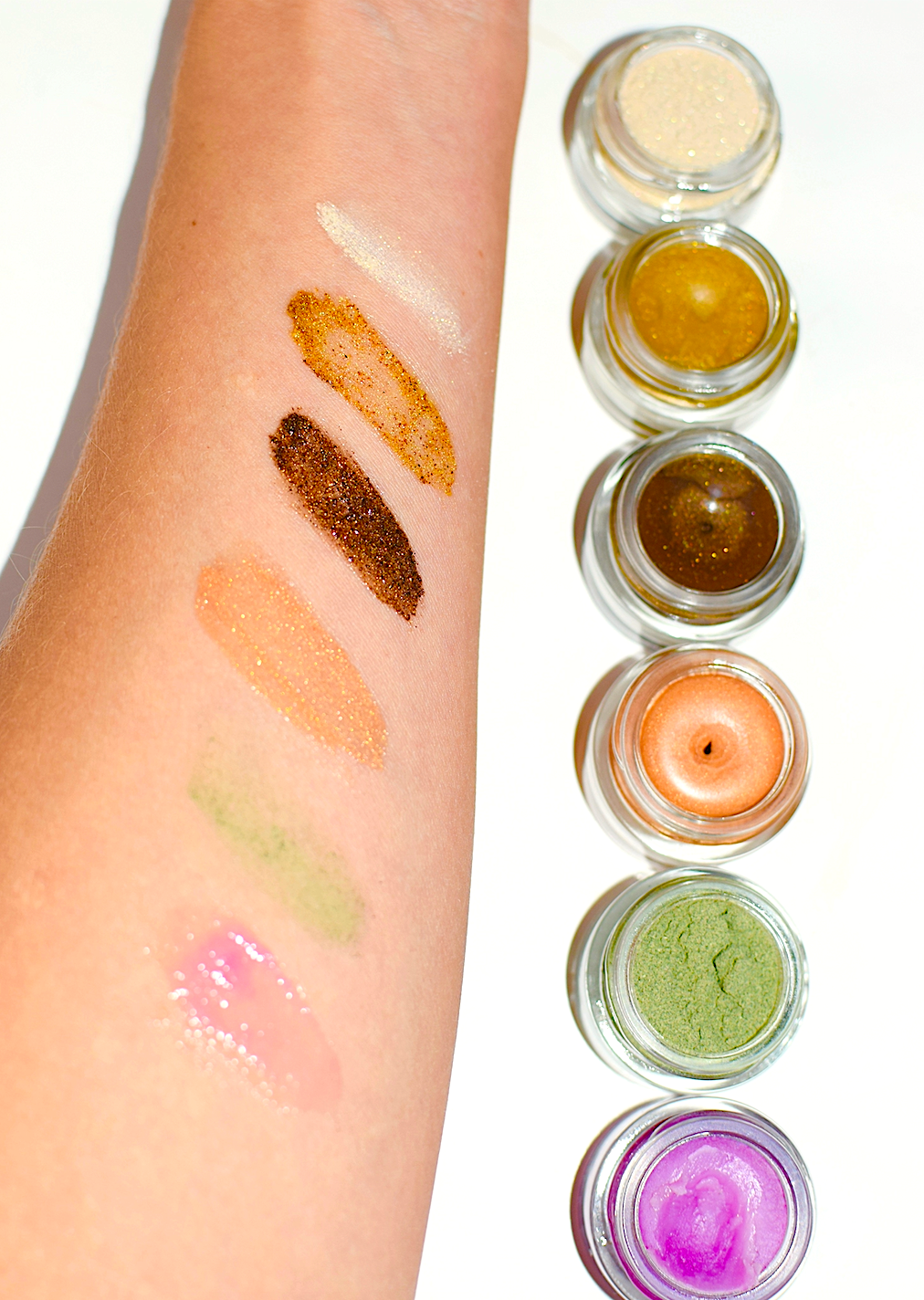 Plant Makeup Dragon Fruit Lip Gloss tube with pink and purple packaging, showcasing vibrant, glossy lip gloss product.