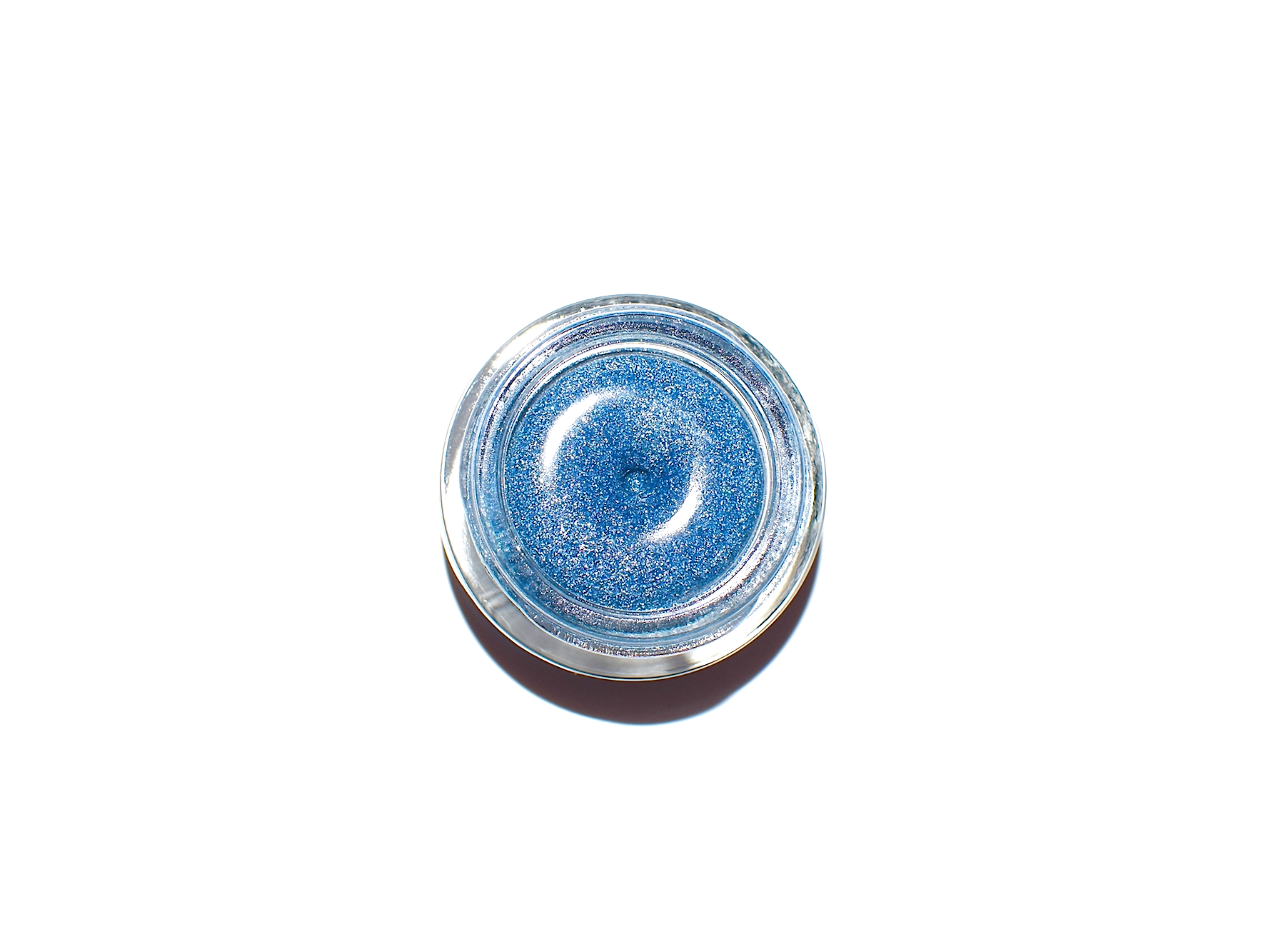 Close-up of a Space Goth Gloss by plant makeup showcasing its glossy, dark iridescent finish in a sleek tube.